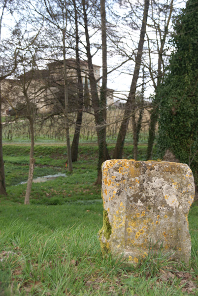 Cruciferous stone pillar in front of chateau La Fleur-Petrus